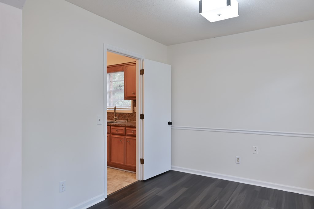 6421 Lemans Lane Columbus, GA 31909 - Photo 12 of 32 a view of an empty room with wooden floor