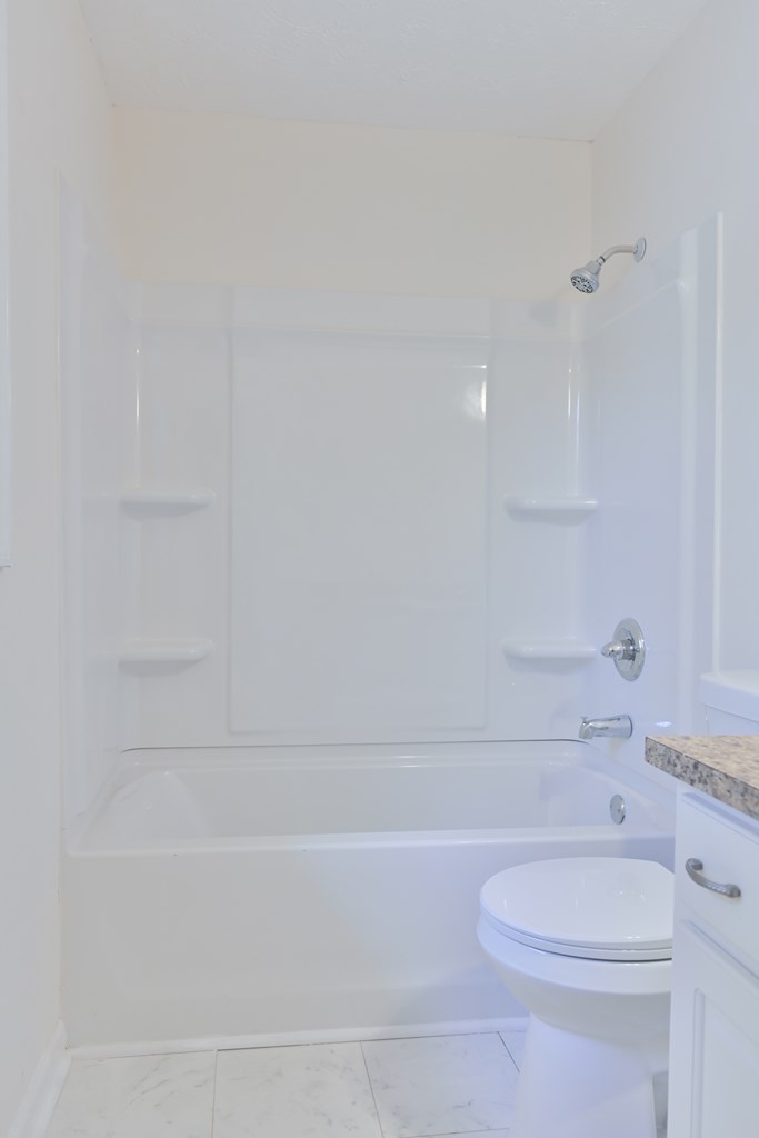 6421 Lemans Lane Columbus, GA 31909 - Photo 32 of 32 a bathroom with a toilet and a bathtub