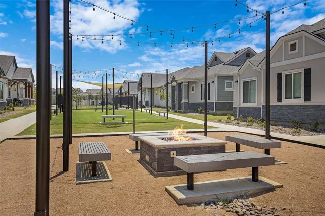 a swimming pool with outdoor seating