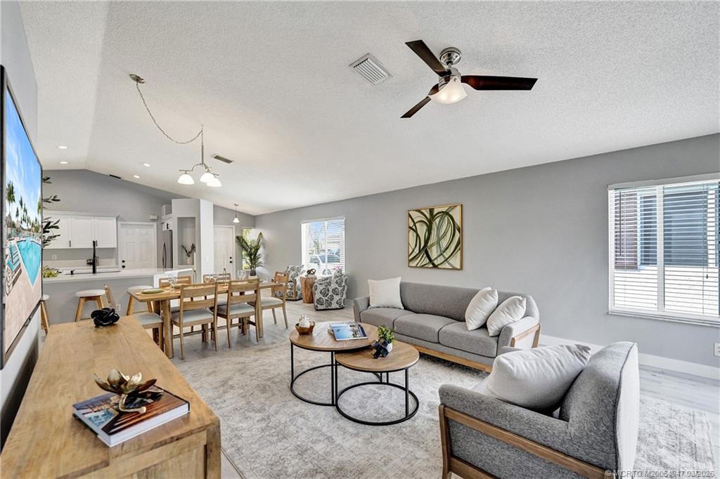 4365 Pine Ridge Court Weston, FL 33331 - Photo 16 of 63 a living room with furniture kitchen view and a window