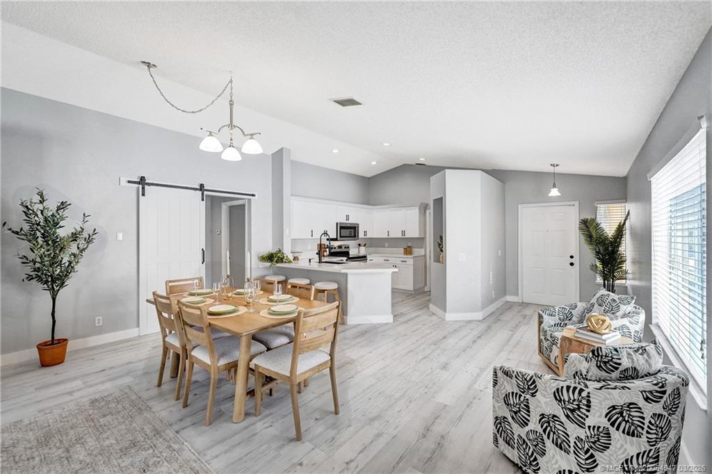 4365 Pine Ridge Court Weston, FL 33331 - Photo 17 of 63 a view of a dining room with furniture and wooden floor