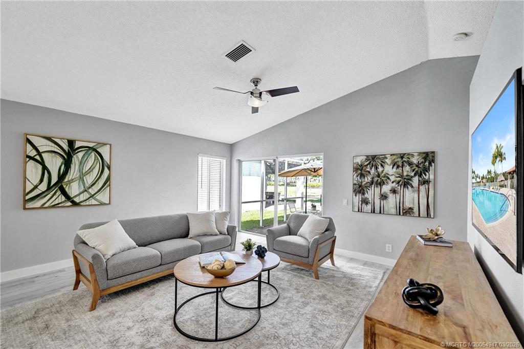 4365 Pine Ridge Court Weston, FL 33331 - Photo 19 of 63 a living room with furniture or couch and a window