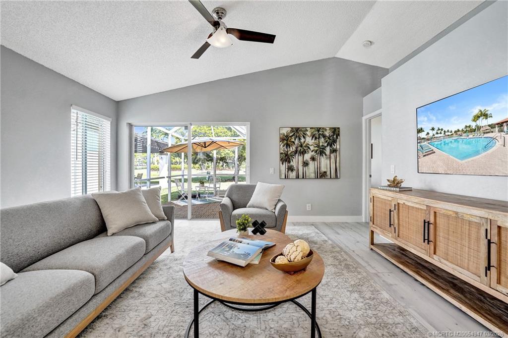 4365 Pine Ridge Court Weston, FL 33331 - Photo 21 of 63 a living room with furniture and a window