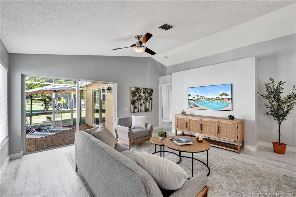4365 Pine Ridge Court Weston, FL 33331 - Photo 22 of 63 a living room with furniture and a large window