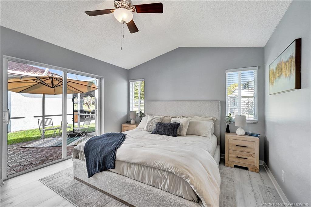 4365 Pine Ridge Court Weston, FL 33331 - Photo 26 of 63 a bedroom with a large bed and a window