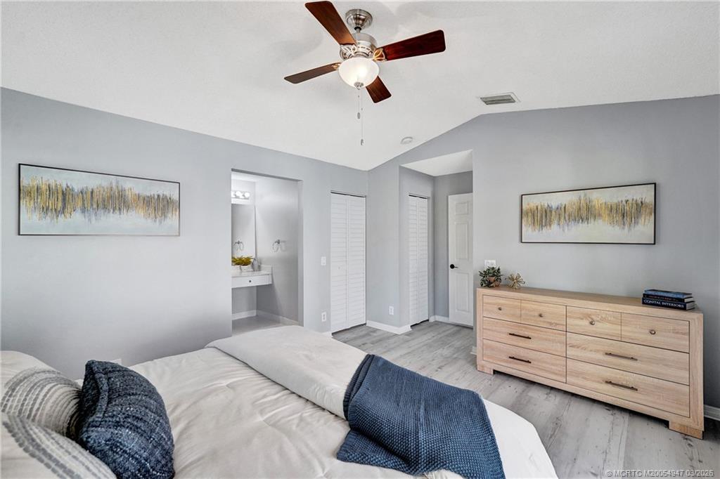 4365 Pine Ridge Court Weston, FL 33331 - Photo 29 of 63 a bedroom with a bed and a dresser