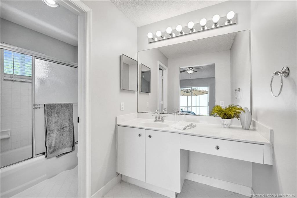 4365 Pine Ridge Court Weston, FL 33331 - Photo 30 of 63 a bathroom with a double vanity sink and a mirror