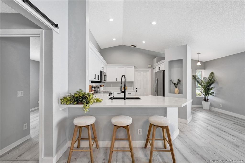 4365 Pine Ridge Court Weston, FL 33331 - Photo 4 of 63 a kitchen with a table and chairs in it