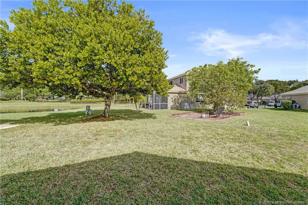 4365 Pine Ridge Court Weston, FL 33331 - Photo 46 of 63 a view of yard with tree and green space