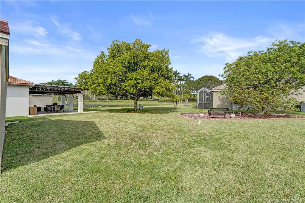 4365 Pine Ridge Court Weston, FL 33331 - Photo 47 of 63 a house view with outdoor space