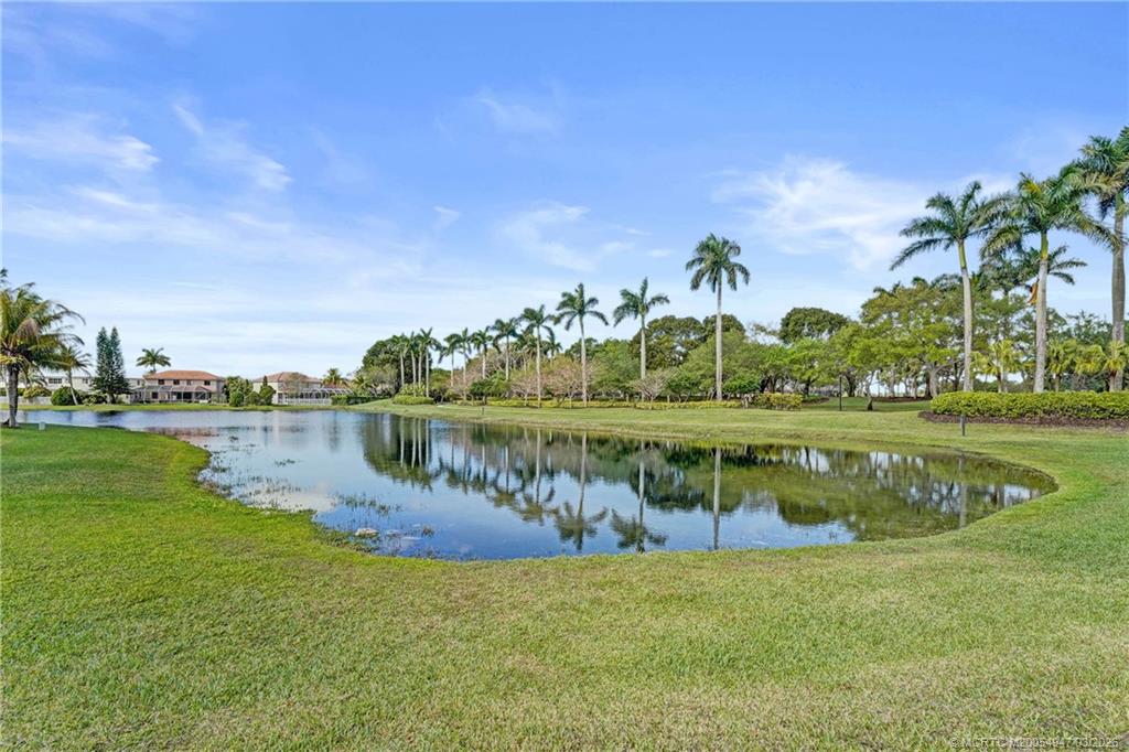 4365 Pine Ridge Court Weston, FL 33331 - Photo 52 of 63 a view of a lake with a building in the background