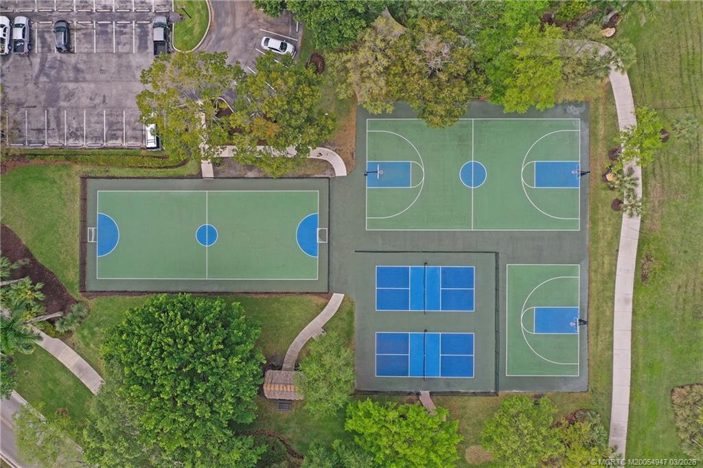 4365 Pine Ridge Court Weston, FL 33331 - Photo 55 of 63 a view of a brick wall with a tree in front of it