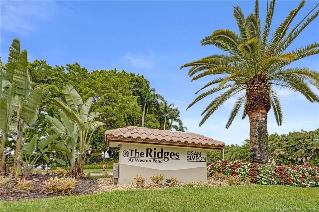 4365 Pine Ridge Court Weston, FL 33331 - Photo 62 of 63 a sign on the side of a road