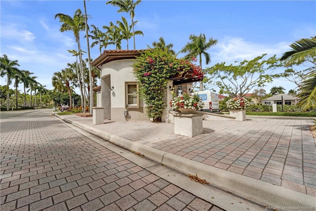 4365 Pine Ridge Court Weston, FL 33331 - Photo 63 of 63 a front view of a house with a yard and potted plants