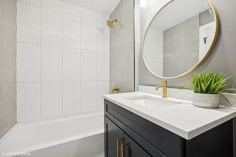 a bathroom with a sink a vanity and a mirror