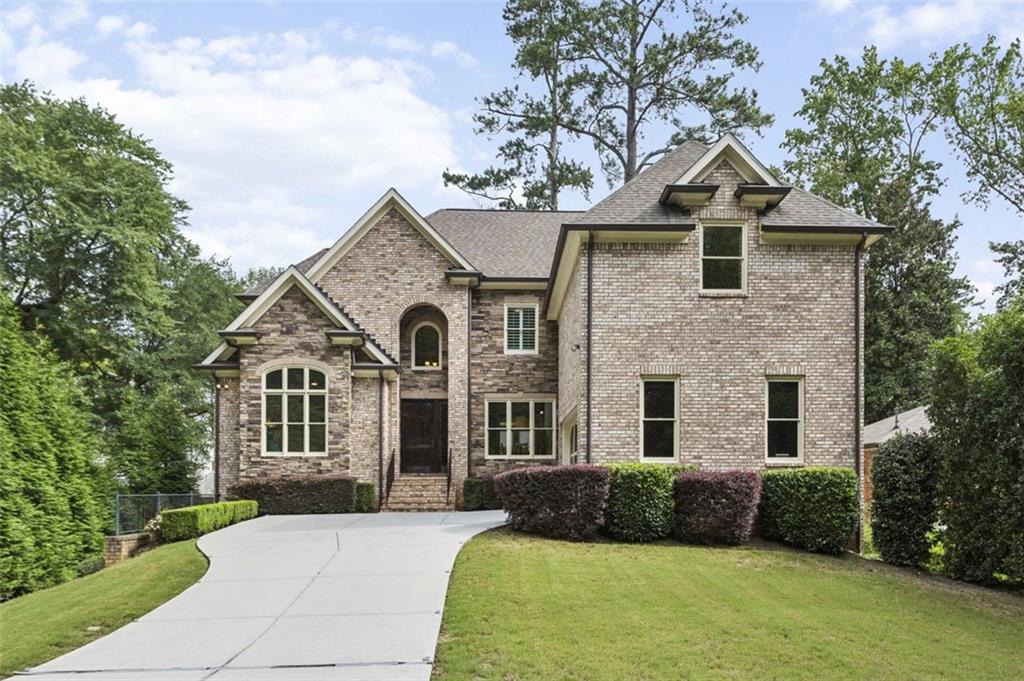 20 West Belle Isle Road Northeast Sandy Springs, GA 30342 - Photo 1 of 1 a front view of a house with a yard