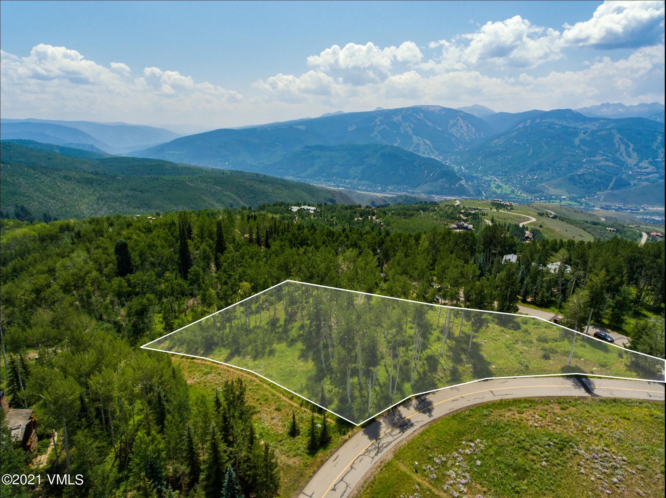 294 Shooting Star Avon, CO 81620 - Photo 1 of 23 a view of a swimming pool with a yard
