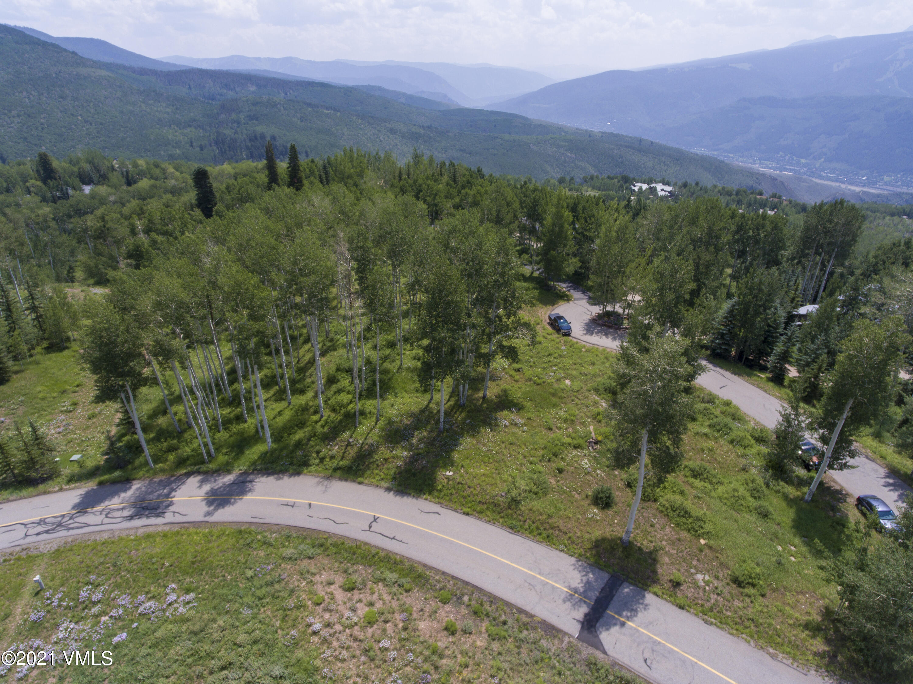 294 Shooting Star Avon, CO 81620 - Photo 12 of 23 a view of a lush green hillside and a houses