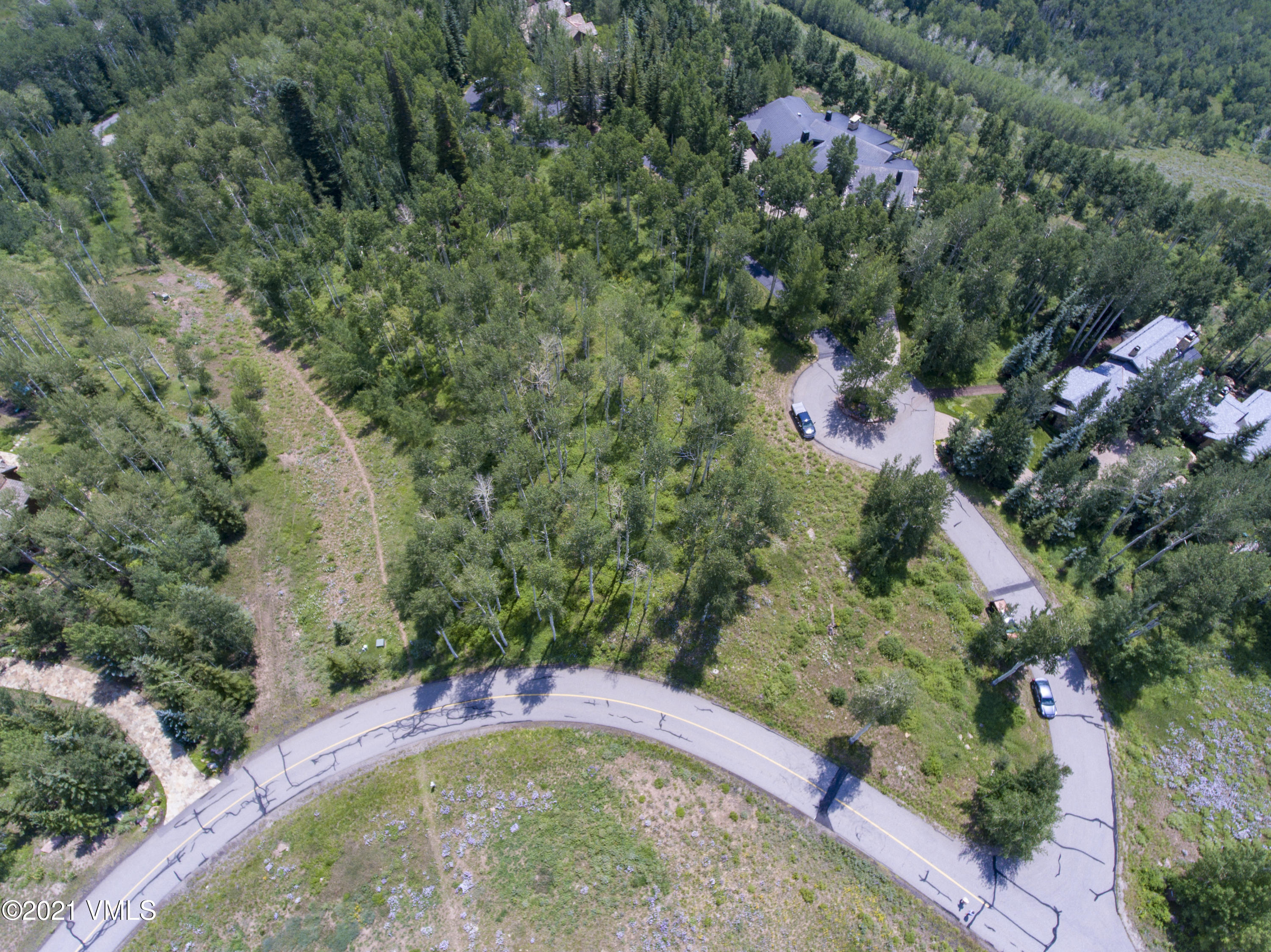 294 Shooting Star Avon, CO 81620 - Photo 13 of 23 a view of a garden with a fountain