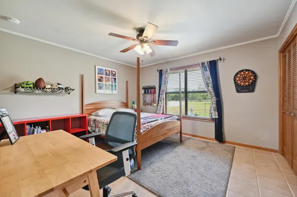 a bedroom with a bed and a table