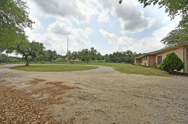 a view of a house with a big yard
