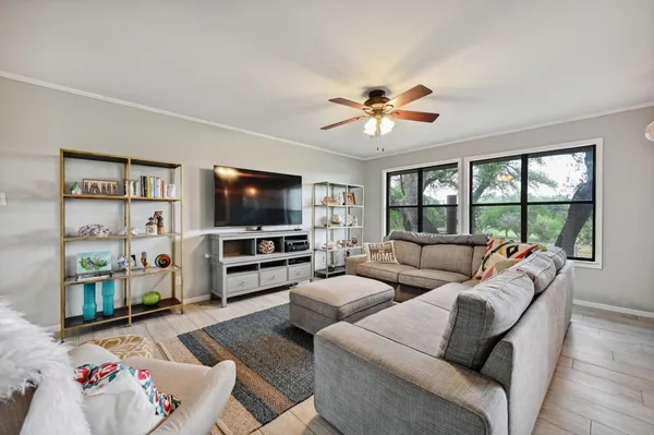 a living room with furniture and a flat screen tv