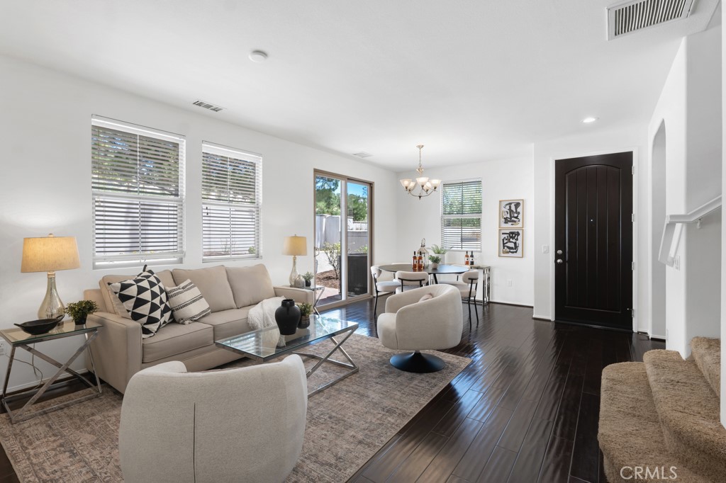 20317 Livorno Porter Ranch Porter Ranch, CA 91326 - Photo 11 of 33 a living room with furniture and a large window
