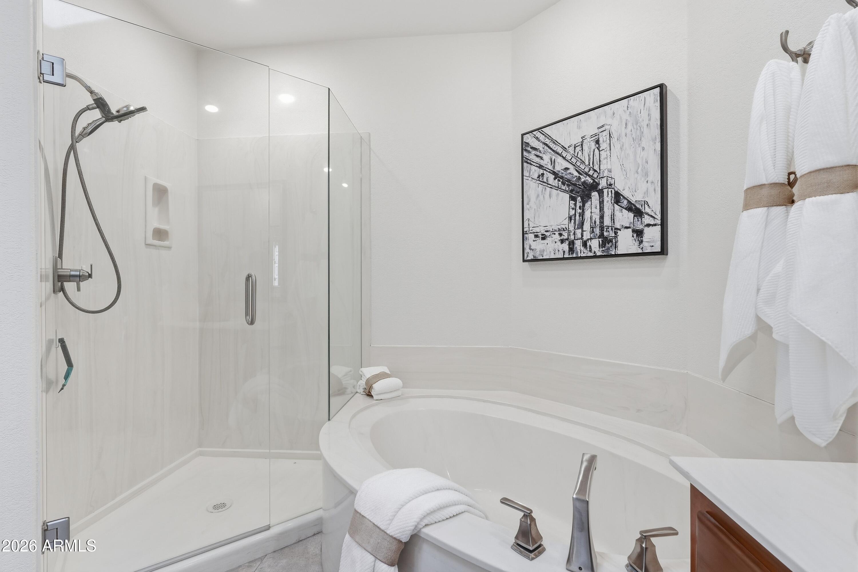 18602 Amarado Circle Rio Verde, AZ 85263 - Photo 19 of 58 a bathroom with a bathtub and a shower