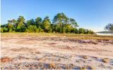 Lot 11 Captains Pointe Road Yulee, FL 32097 - Photo 3 of 16 a view of dirt field with trees in the background