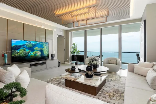 a lobby with furniture and a potted plant