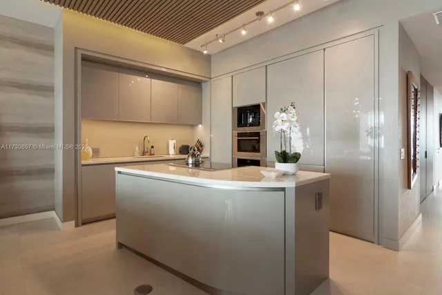 a kitchen with a sink stainless steel appliances and cabinets
