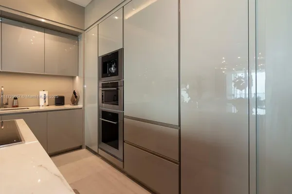 a bedroom with a large bed and a flat screen tv