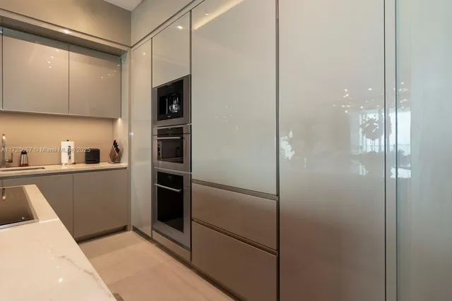 a bedroom with a large bed and a flat screen tv