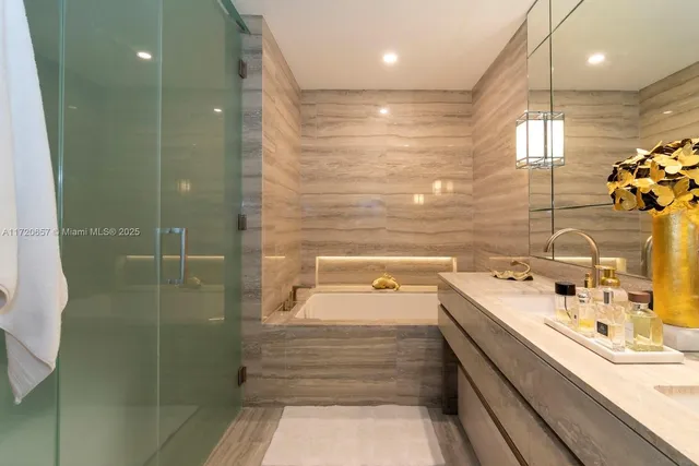 a bedroom with a bed and glass windows