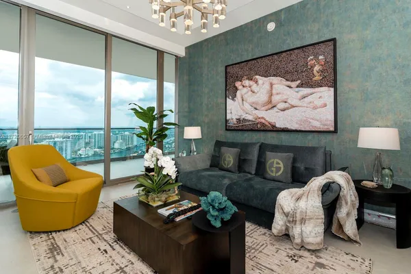 a bedroom with two beds and a potted plant