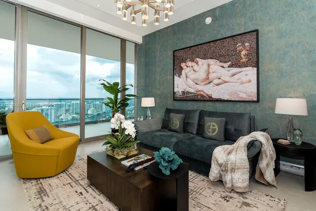 a bedroom with two beds and a potted plant