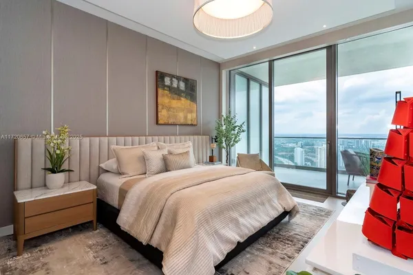 a view of a hallway with paintings on the wall