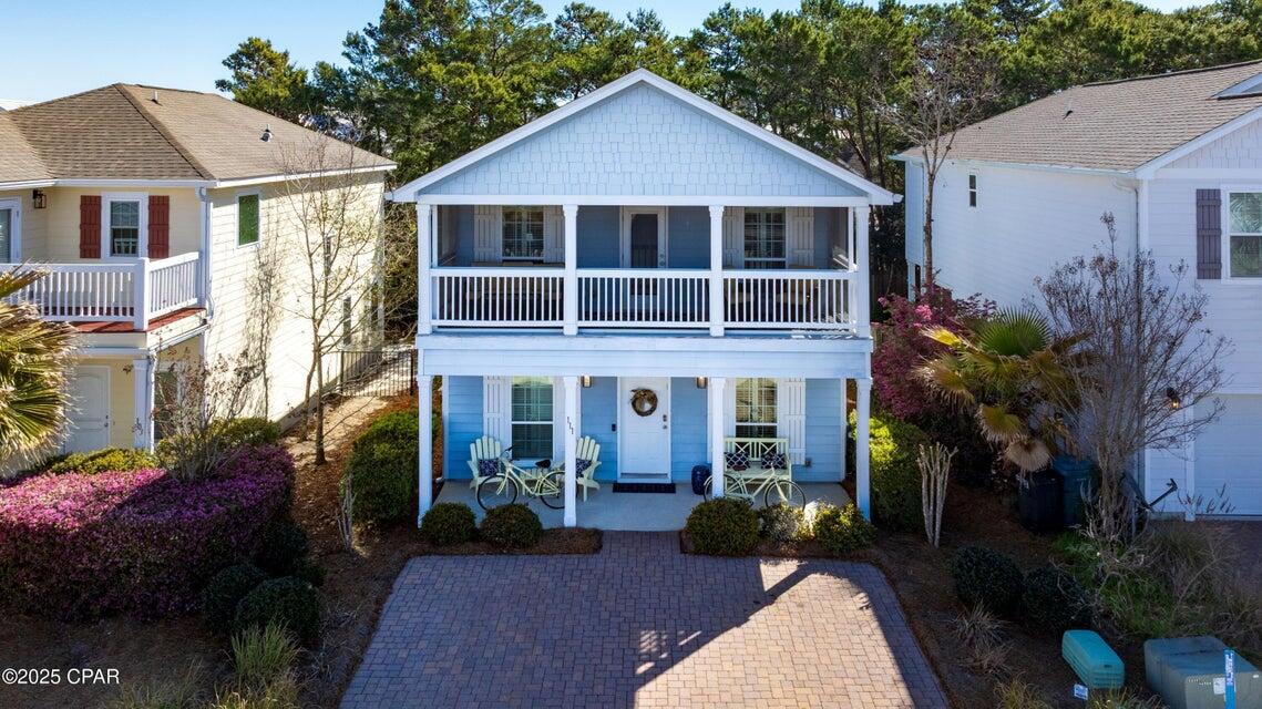 111 West Shore Place Inlet Beach, FL 32461 - Photo 14 of 45 a view of a house with a yard and potted plants