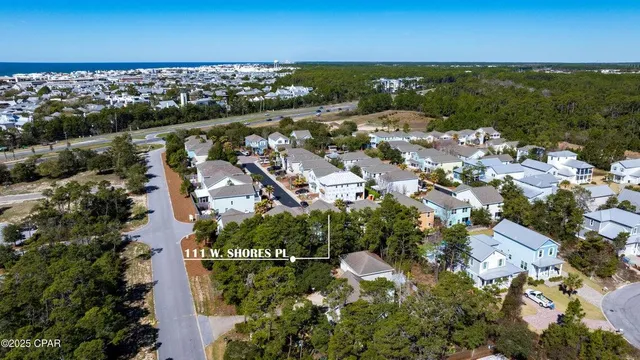 an aerial view of residential houses with outdoor space