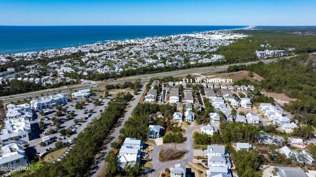 an aerial view of a city with ocean view