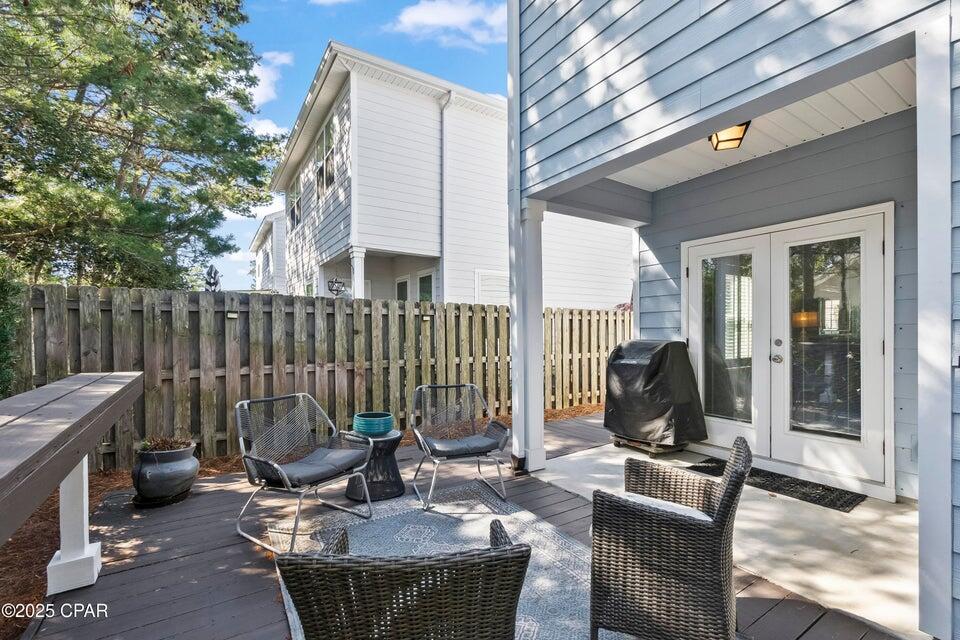 111 West Shore Place Inlet Beach, FL 32461 - Photo 32 of 45 a view of backyard with outdoor seating a patio and a garden