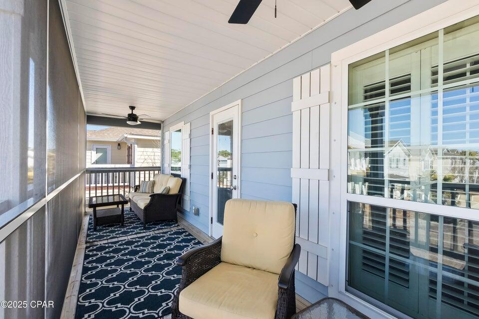 111 West Shore Place Inlet Beach, FL 32461 - Photo 38 of 45 a balcony with furniture and wooden floor