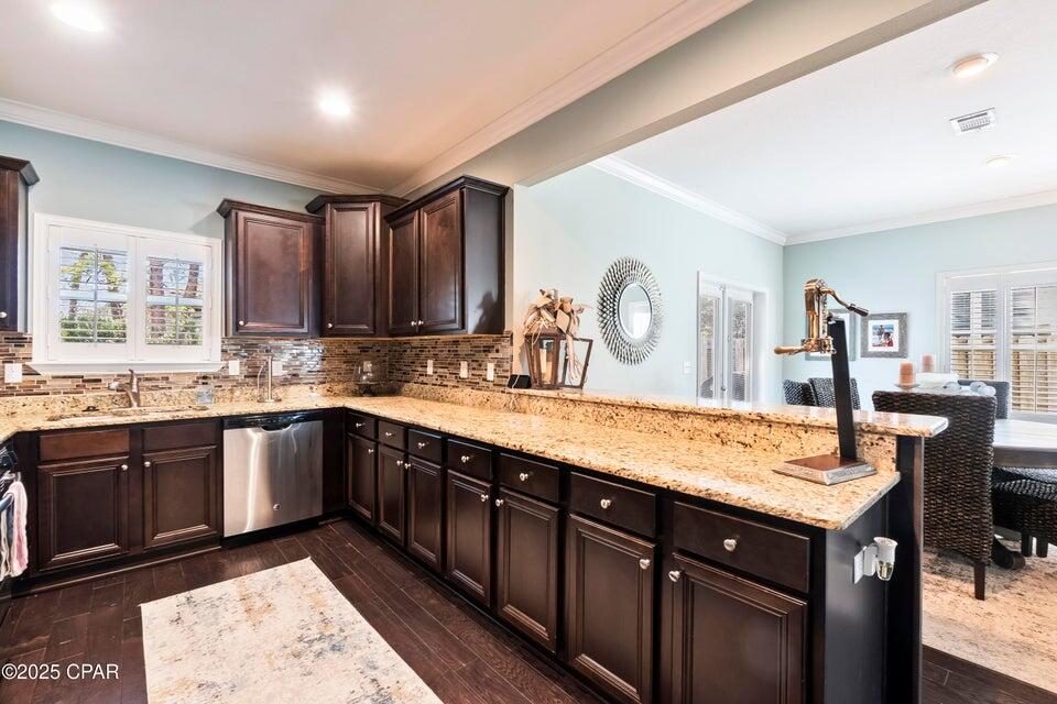 111 West Shore Place Inlet Beach, FL 32461 - Photo 5 of 45 a large kitchen with kitchen island granite countertop a sink and cabinets