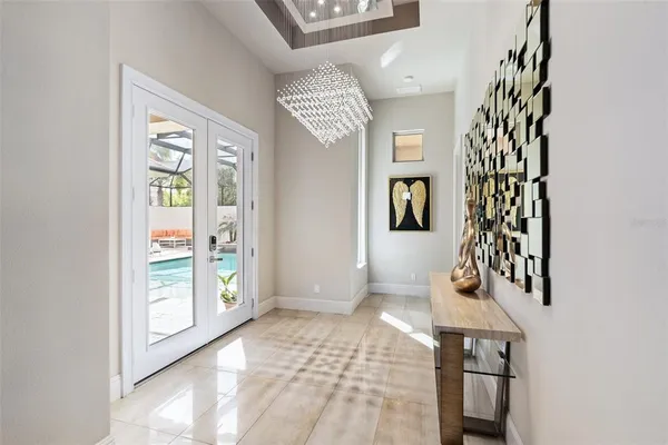 a spacious bedroom with a bed and flat screen tv