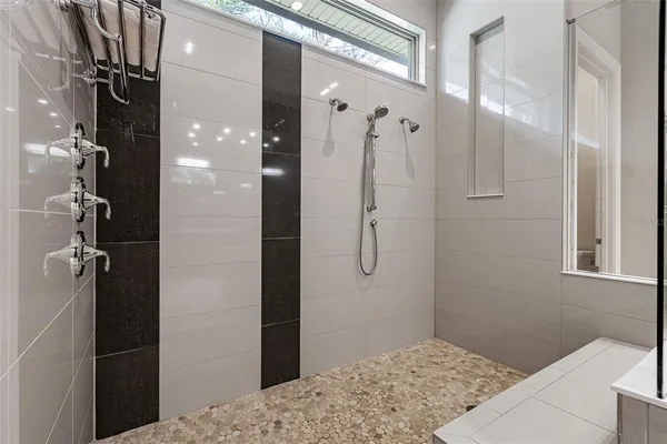 a kitchen with stainless steel appliances granite countertop a sink and dishwasher with white cabinets