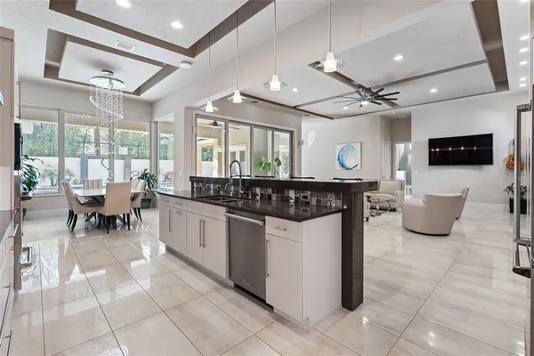 a kitchen with stainless steel appliances granite countertop a sink and cabinets