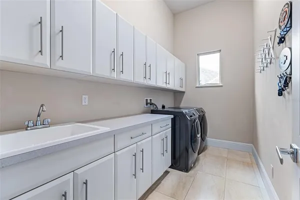 a view of a backyard with a patio and swimming pool