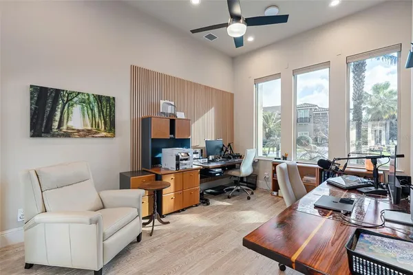 a view of walk in closet with clothes