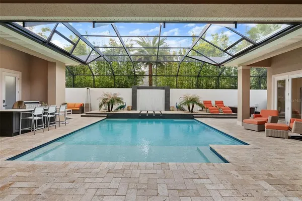 a front view of house with a garden and patio