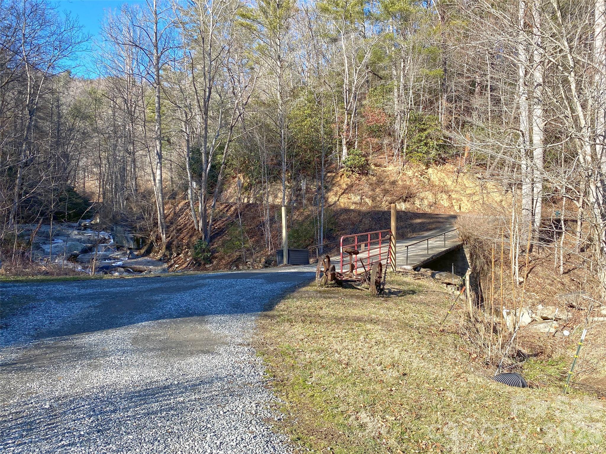7385 Big Pine Road Marshall, NC 28753 - Photo 32 of 38 a view of a backyard with chairs and fire pit